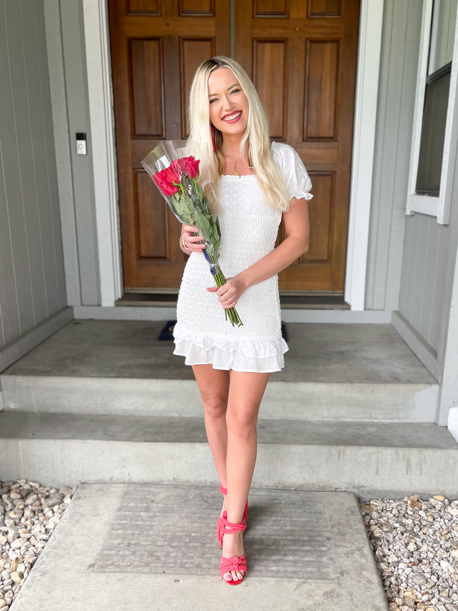 Shay holding roses to celebrate the season finale of The Bachelor