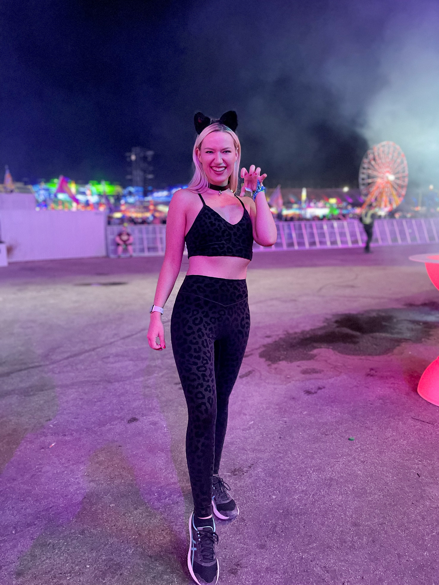 Shay wears a black cat costume at EDC 2021